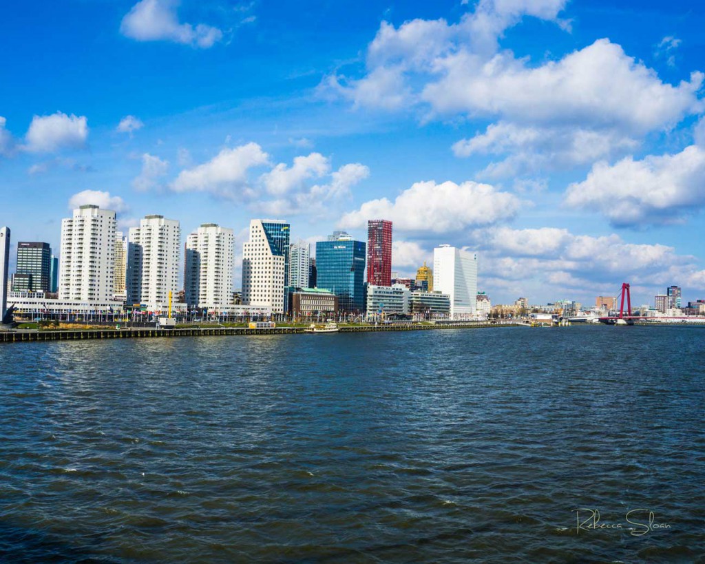 Buildings in Rotterdam across a river.